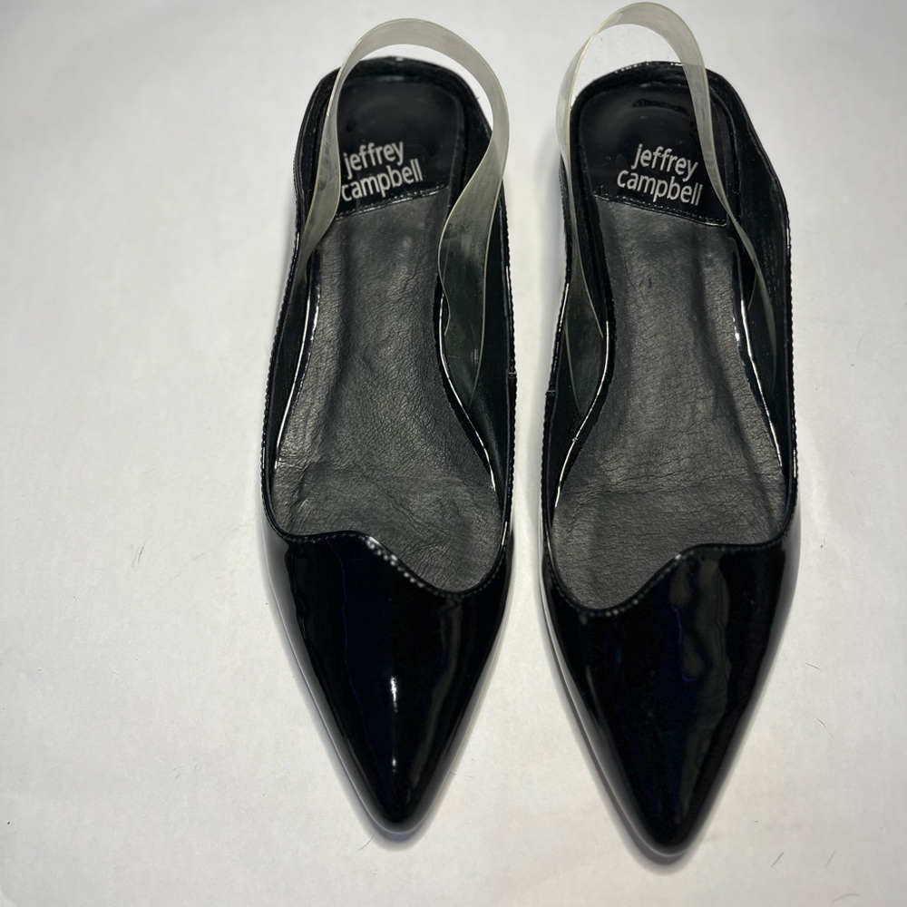 Size 6.5 Jeffrey Campbell black kitten heel flats with extra heel caps.